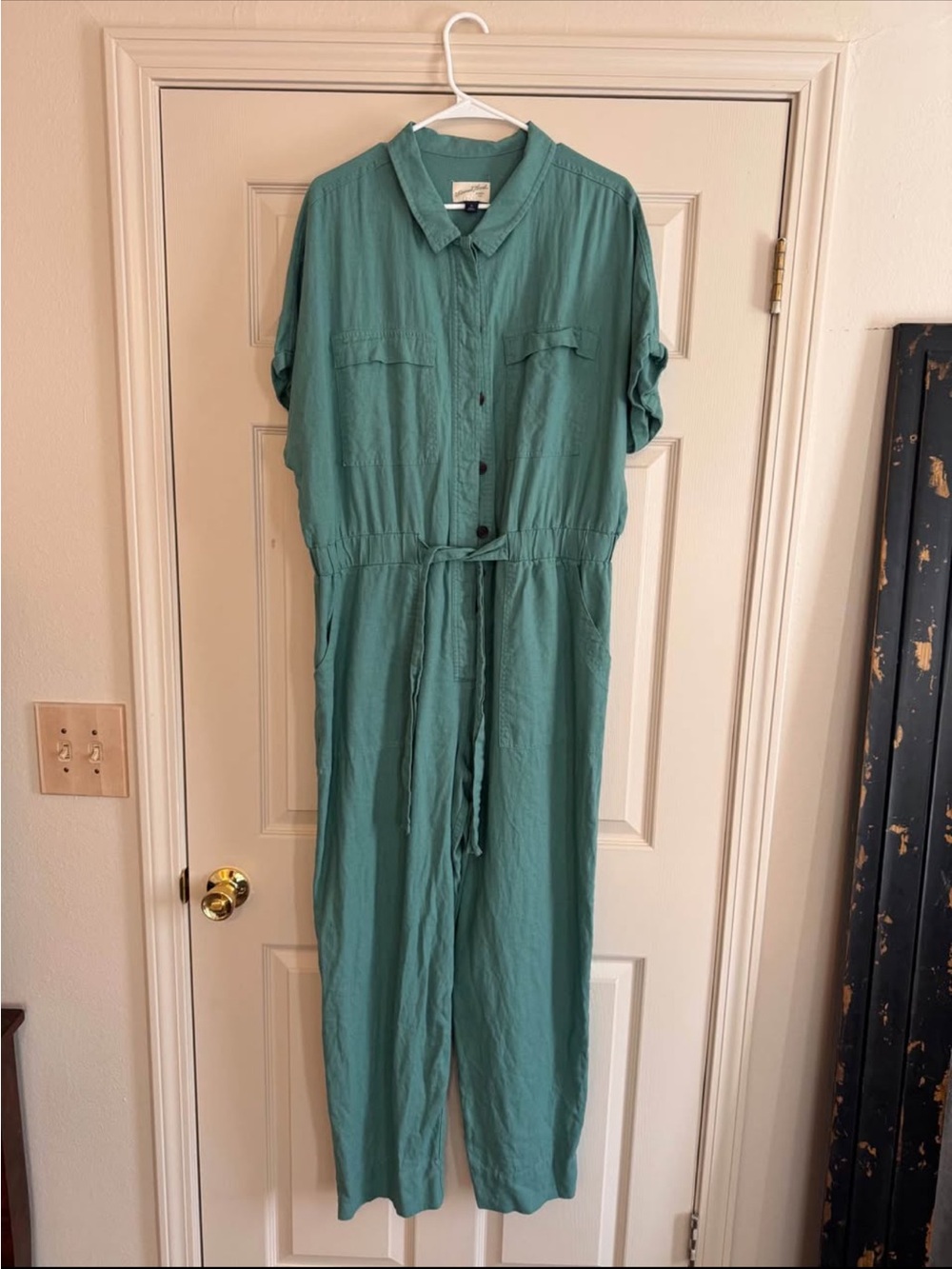Teal women’s jumpsuit with buttons